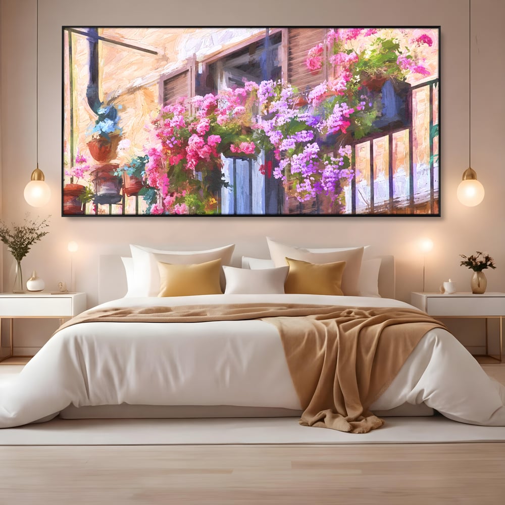 Tablou canvas cu pictura cu balcon plin de flori roz, in rama de aluminiu negru, pe perete intr-un dormitor